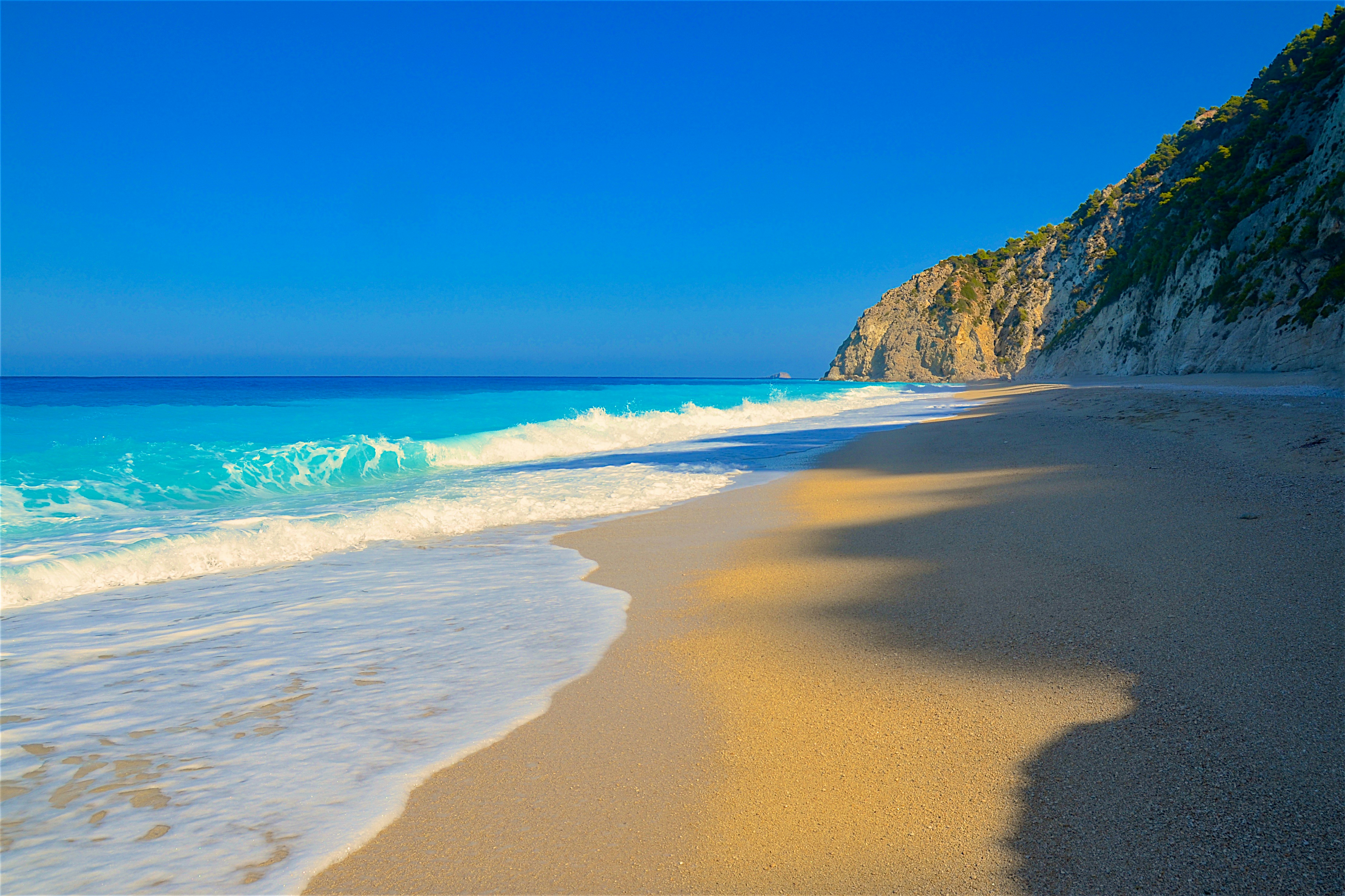 Lefkada's dramatic west coast cliffs meeting the turquoise Ionian sea