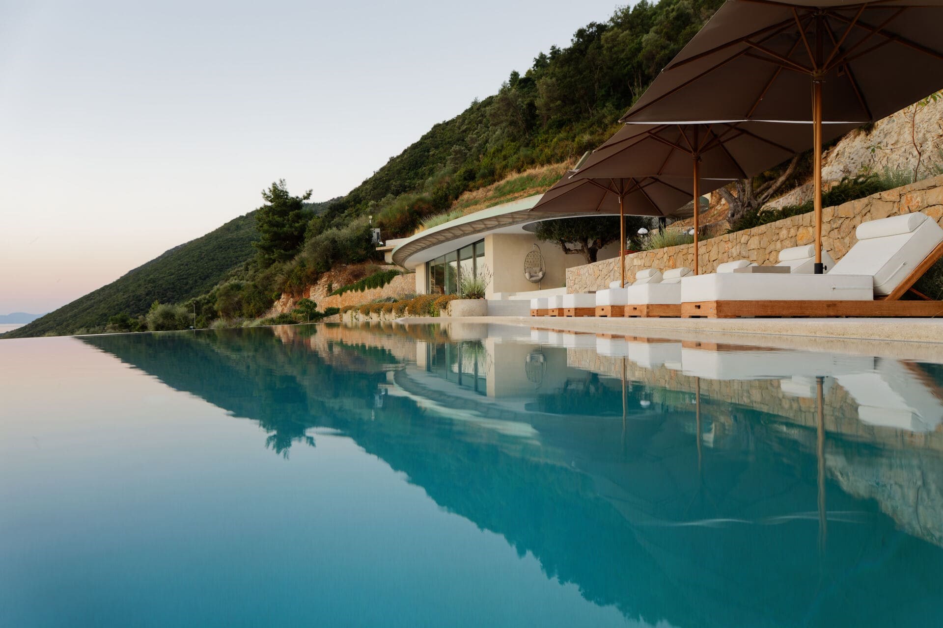 Thyta House villa exterior concrete architecture by LASSA Architects, Lefkada